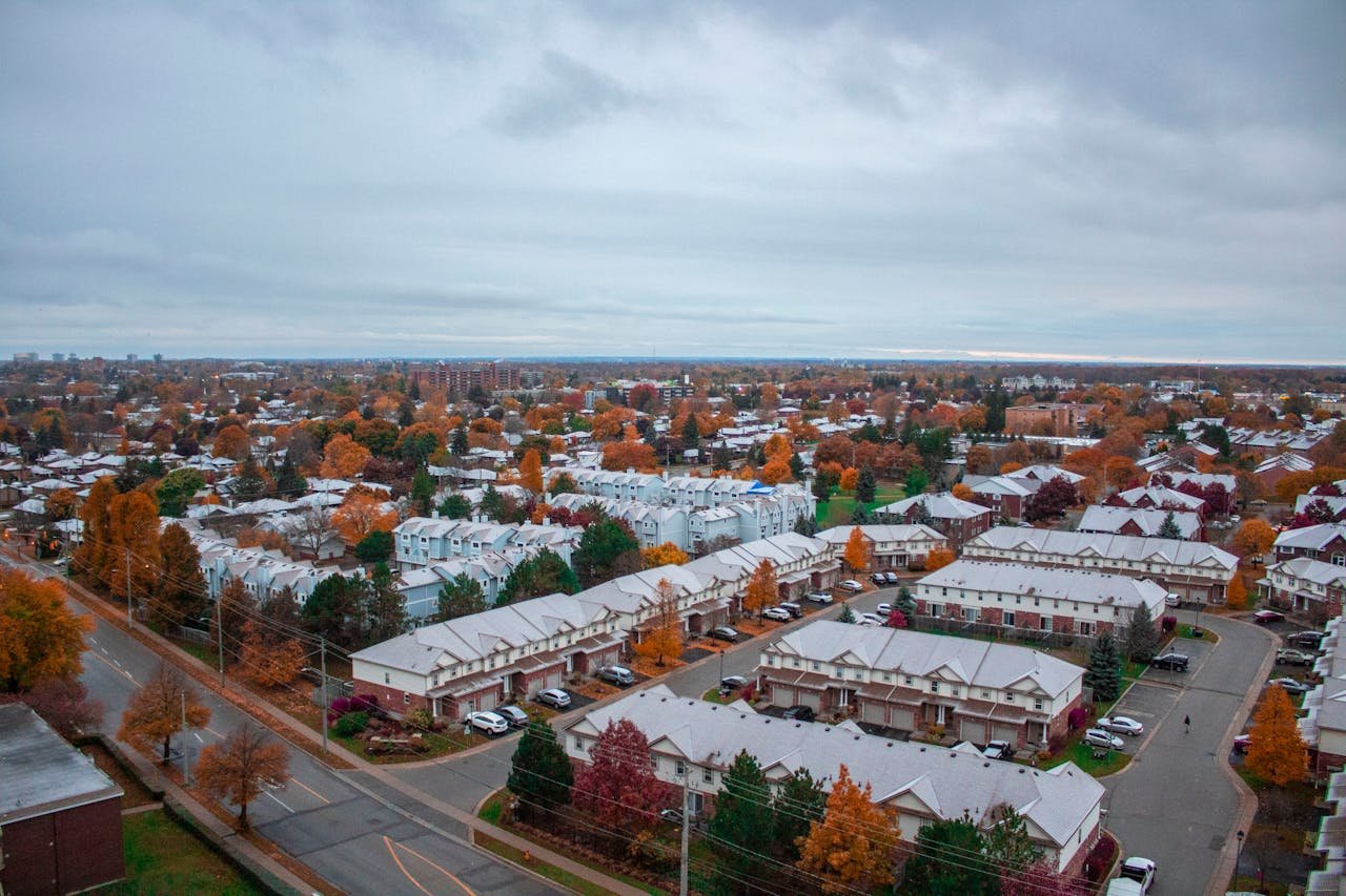 services-02 Scenic aerial view of suburban Kitchener, Ontario in fall with colorful foliage.